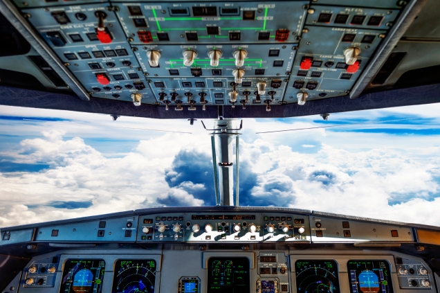 plane cockpit and cloudy sky